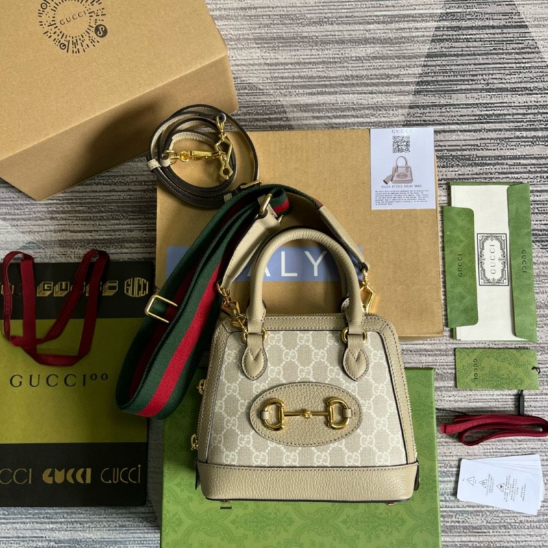 G*u*i top handle bags